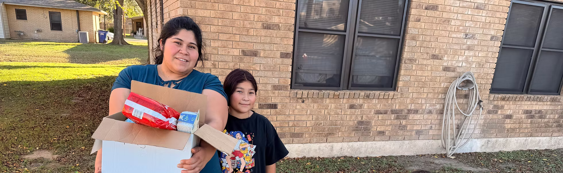 A family receiving essential supplies at home