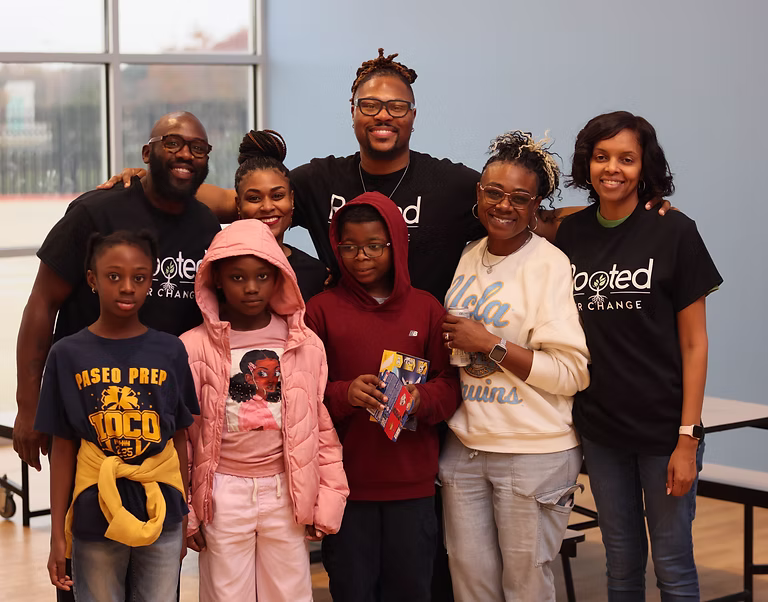 ROOTED team members and children together at a community event